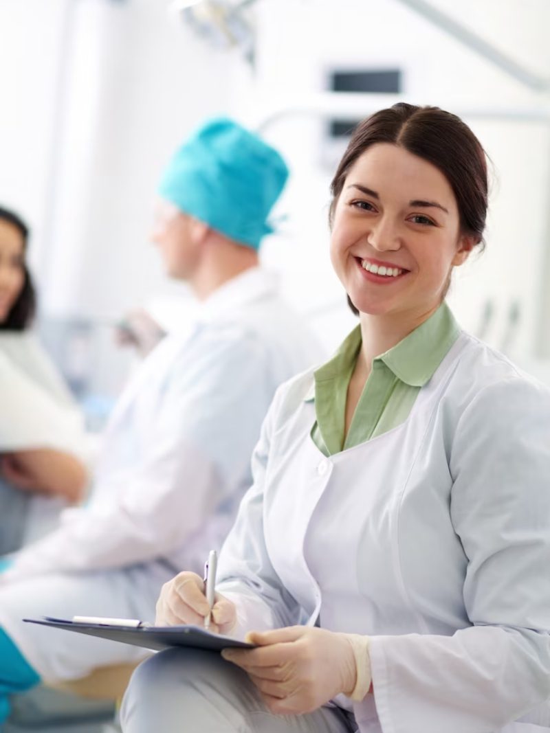 Smiling dentist in the clinic